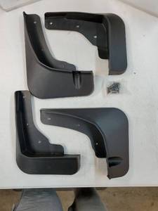 lot 56992 image: Black Plastic Car Mud Flaps Set with Hardware. SIZE UNKNOWN - Retail $25