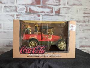 lot 602 image: Coca-Cola 1918 Pickup Truck with Elf and Penguins Die-Cast Metal Model