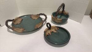lot 1511 image: Signed pottery with leaf accents