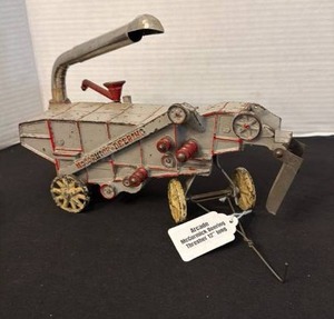 lot 1012 image: Arcade McCormick Deering thresher