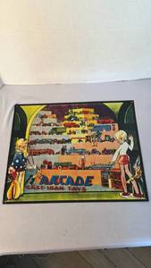 lot 1081 image: Vintage metal Arcade cast iron toys sign 12 x 14 in