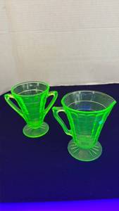 lot 1113 image: Uranium glass creamer and pitcher set
