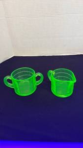 lot 1115 image: Uranium glass creamer and pitcher set