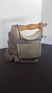 lot 1200 image: Cast Iron Clothes Iron with Wood Handle and Decorative Rest