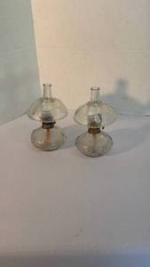lot 1312 image: Antique Lincoln Drape miniature oil lamps made of clear glass