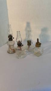lot 1315 image: Vintage clear glass miniature oil lamps