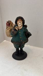 lot 1604 image: Pecan shell wood world Santa figurine holding sack of toys 10 inches tall