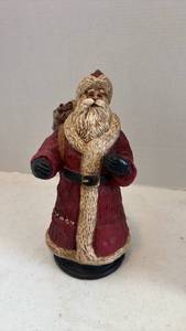 lot 1609 image: Pecan shell wood world Santa figurine with toy sack 10 inches tall