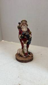 lot 1610 image: Pecan shell wood world Santa figurine with reindeer and toys 8 inches tall