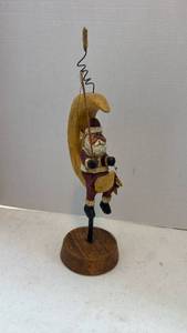lot 1612 image: Wooden figurine of Santa Claus sitting on a crescent moon 16 inches tall