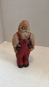 lot 1615 image: Pecan shell wood world Santa figurine holding tools 8 inches tall