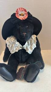 lot 1634 image: Black Teddy Bear with Hat