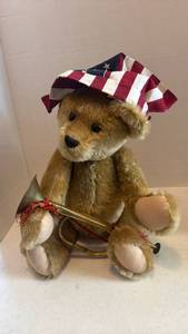 lot 1639 image: Calico and Sawdust teddy bear with trumpet and bandanna 20 inches