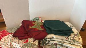 lot 1958 image: Holiday table cloths, table runner, napkins and patchwork tree skirt