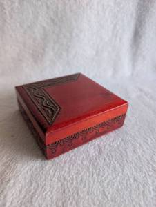 lot 1504 image: Red Wooden Jewelry Box with Carved Geometric Design