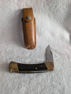 110 Buck Folding Knife with Leather Sheath