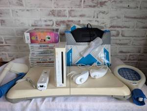 lot 5500 image: Nintendo Wii Console Bundle with Wii Fit Balance Board, Games, and Accessories - Read full description