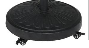 lot 15966 image: StyleWell 50 lbs. Concrete and Resin Patio Umbrella Base in Black (Does not include umbrella pole and tightening rods) Retails $64