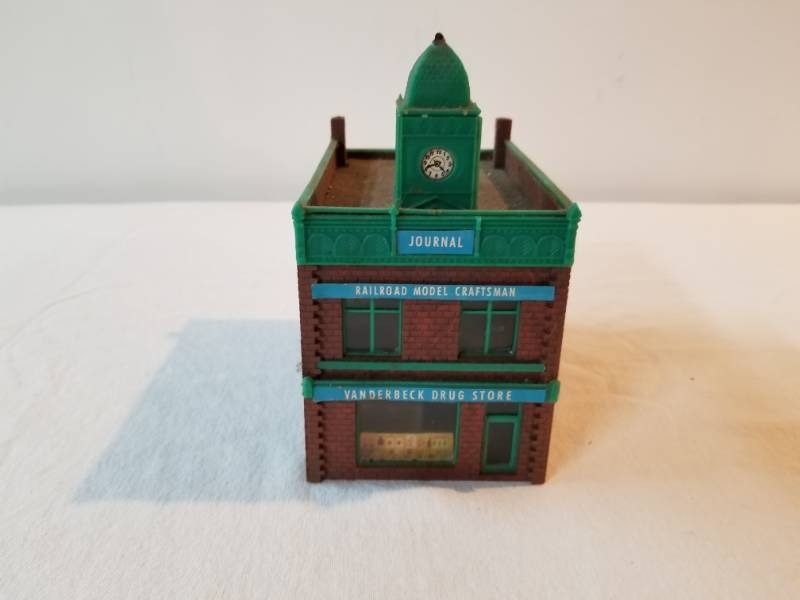 lot 7433 image: Drug Store Brick Building with Clock Tower for HO Scale Train Setup