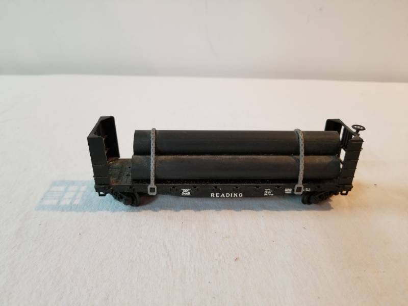 lot 7456 image: HO Scale Train Set Specialty Car Carrying Three Pipes Fully Functioning