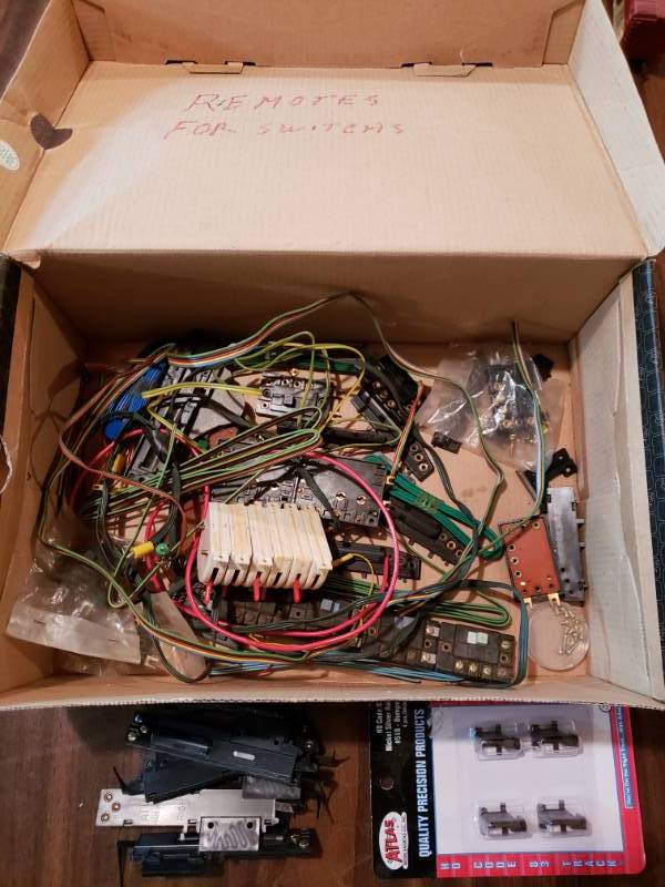 lot 7498 image: Box of Remotes for Switches