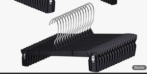 lot 36316 image: Hanger Central 25 Pack 12 Inch Black Plastic Pants Hangers with Extra Long Clips