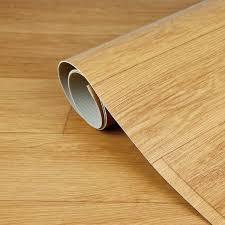 lot 4392 image: Wood Grain Vinyl Flooring Roll With Adhesive Backing