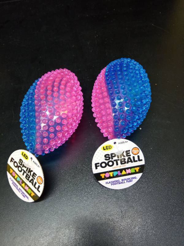lot 2069 image: (2) Spike Footballs LED Flashing bouncing fun - Retail $11