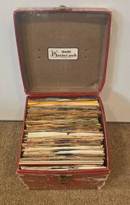 lot 119 image: 45s in Case Includes The Beatles She loves you, Chuck Barry My Ding a Ling and more