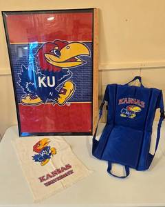 lot 132 image: KU Memorabilia 36 x 24 Framed Poster,  Stadium Seat and Towel
