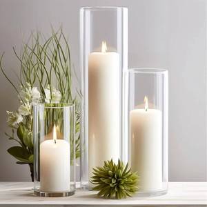lot 899 image: Sandraheer 11-Pack White Pillar Candles with Clear Hurricane Glass Vases - 3-Size Set for Wedding Table Centerpieces, Home Decor  Windproof Candle Holders - Retail $70