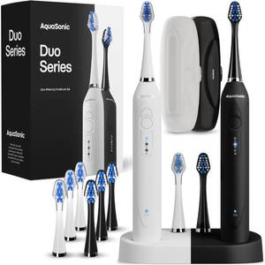 lot 7903 image: Aquasonic Duo - Dual Handle Ultra Whitening 40,000 VPM Wireless Charging Electric ToothBrushes - 3 Modes with Smart Timers - 10 Dupont Brush Heads & 2 Travel Cases Included