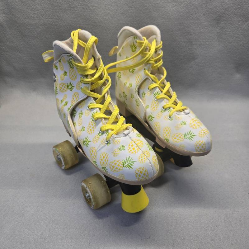 lot 385 image: Pineapple Print Quad Roller Skates with Yellow Laces