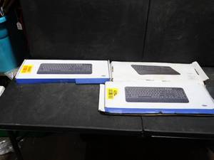 lot 26460 image: 3 New Jelly Comb Keyboards
