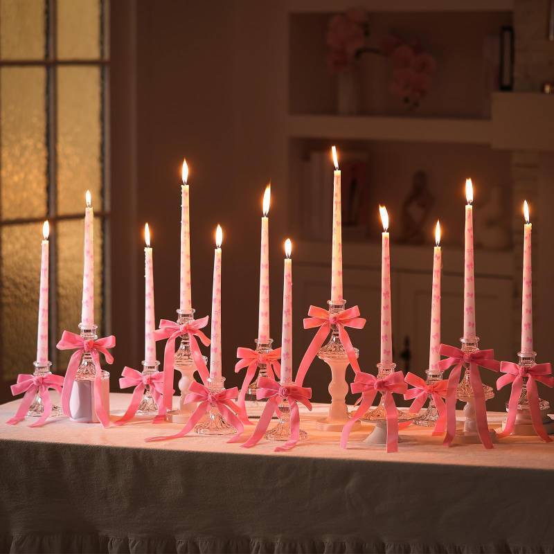 lot 36446 image: 12 Set Pink Bow Coquette Taper Candles with Glass Candlestick Holders Christmas 10 Inch Tall Pillar Candles. FOUR CANDLES BROKEN. - Retail $44