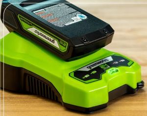 lot 1095 image: Greenworks 24V Lithium Battery and Charger Set - Retail $112