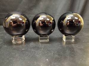 lot 1110 image: Three Black Crystal Balls,Solid Crystal Ball,K9 Crystal Glass Ball with Free Crystal Stand (60MM, Black) - Retail $0