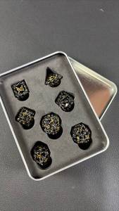 lot 23 image: Black & Gold Skull Dice Set with Storage Case