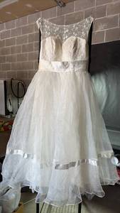 lot 125 image: Ankle Length White Lace Wedding Dress with Tulle Skirt and Satin Sash Appears to Be Size Eight