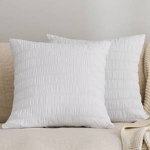 lot 31523 image: JELLYMONI Seersucker Throw Pillow Cover 18 x 18 inch, 2 Pack Textured Pillow Covers with Zipper Closure, Breathable White Decorative Pillowcase for Stylish Bedding & Couch (Insert Not Included) - Retail $9