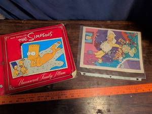 lot 59 image: The Simpsons Uncensored Family Album Book with Original Art Print
