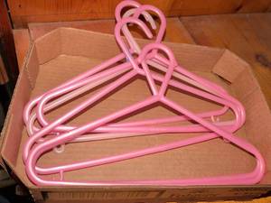 lot 275 image: Pink Plastic Clothing Hangers Set