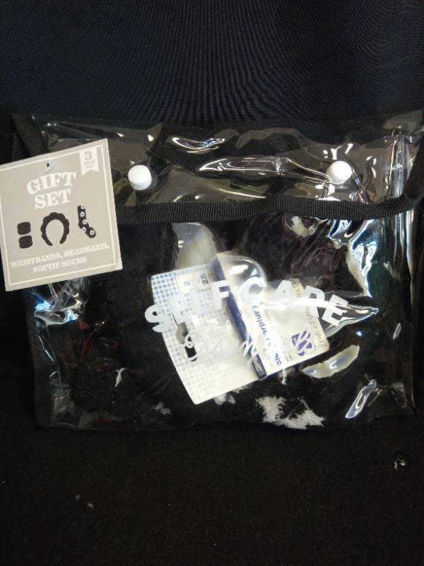 lot 2048 image: Self Care Essentials Puffy headband, Cuffs, Black Cozy Socks  Sleeping Earplugs  - Retail $2