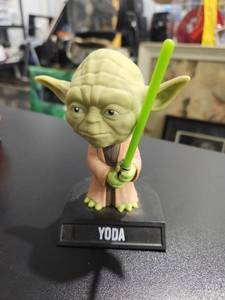 lot 3280 image: Star Wars Yoda Funko Pop Bobblehead Figure with Green Lightsaber