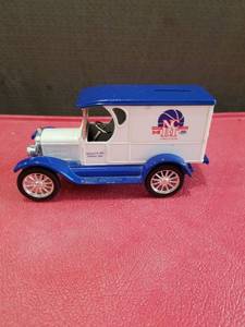 lot 3335 image: Die Cast Model T Delivery Truck Bank with Basketball College Logo