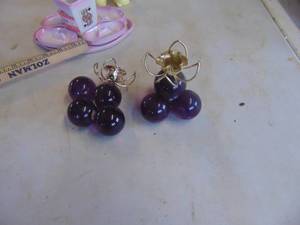 lot 4499 image: Pair of Resin Grape Candle Sticks - one needs repaired