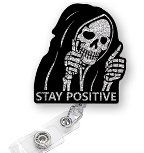 lot 4696 image: Funny Halloween Skeleton Badge Reel Retractable, Stay Positive Skull Badge Reel, Horror Badge Holder with Alligator Clip & 24 Durable Nylon Cord for Nurse Nursing Student RN LPN CNA & Medical Worker - Retail $0