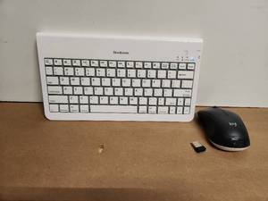 lot 54 image: Brookstone Wireless Keyboard and Logitech Mouse Set
