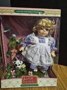 lot 183 image: Classic Treasures Fine Bisque Porcelain Collectible Doll with Curly Hair and White Apron