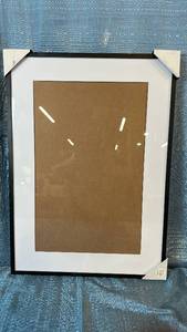 lot 2090 image: Threshold Black Photo Frame 15x21 Matted To 11x17.